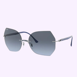 A pair of hexagonal, rimless Ray-Ban RB8065 003/8F 62 women sunglasses with blue gradient lenses and metal arms. The Lexor Miami logo appears at the top, and the Ray-Ban Sunglasses logo is at the bottom of the image.