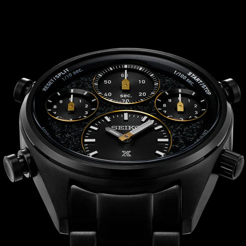 Close-up of the Seiko Watches Chronograph Solar SFJ007, a black limited edition wristwatch with three gold-accented subdials, push buttons, and textured dial. Features Seiko and Prospex logos. Made for the Speedtimer World Athletics Championship.