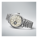 The Seiko Luxe Watches Presage Classic Series SPB469 features a silver stainless steel bracelet, cream dial with open-heart feature, and subdial, elegantly displayed at an angle on a light gray background.