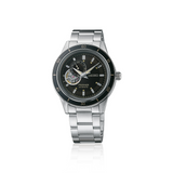 The Seiko SSA425 Presage Style60's men's watch by Seiko Watches features a stainless steel strap, black dial, silver hour markers, and an open-heart design at 9 o’clock on a white background.