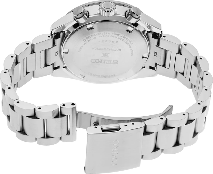 A close-up view of the back of a Seiko Watches Speedtimer Solar Chronograph SSC931 with a stainless steel band, featuring the engraved case back and partially open clasp.