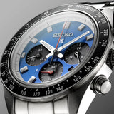Close-up of Seiko Watches’ Speedtimer Solar Chronograph SSC931 featuring a blue dial, three subdials, silver hour markers, a black bezel with tachymeter scale, and dynamic red, white, and silver hands.
