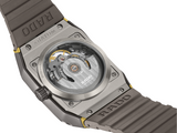 Close-up of the Rado Watches Anatom Automatic Skeleton R10206109 shows its transparent case revealing intricate mechanics, brown strap, and visible Rado Watches branding on both strap and case.