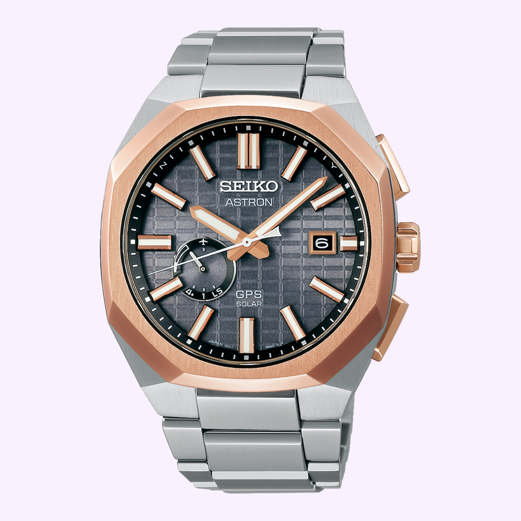 Seiko Astron SSJ014 GPS Solar Titanium Watch Seiko Astron GPS Solar SSJ014 titanium watch with gray textured dial, rose gold-tone bezel and integrated titanium bracelet