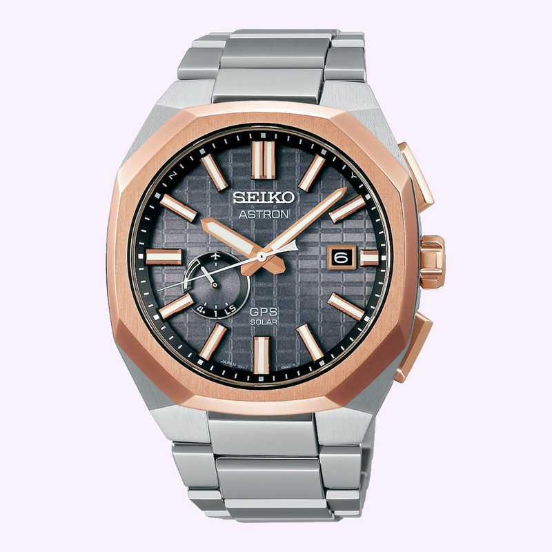 Seiko Astron GPS Solar SSJ014 – Front View Seiko Astron GPS Solar SSJ014 with gray textured dial, rose gold-tone octagonal bezel and titanium bracelet, front view