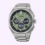 Silver-toned Seiko King Watches Astron HAB005 GPS Solar chronograph featuring a textured light green dial, three dark sub-dials, and a metal link bracelet.