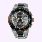 The Seiko Luxe Watches King Astron SSH183 Limited Edition features a silver and black metal band, grey dial with orange accents, multiple subdials, GPS, solar technology, numeric markers, and "CHRONOGRAPH" on the bezel.