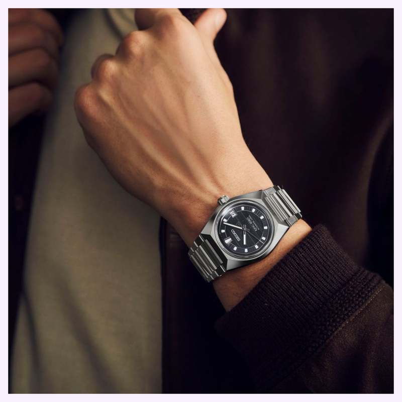 Wrist shot of King Seiko VANAC HKF005 with silver stainless steel case, dark dial and metal link bracelet