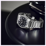 Seiko King Watches King Seiko VANAC HKF005 wristwatch with a black dial and faceted indices on a rounded black table.