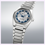 A Seiko Luxe Watches King VANAC HKF004 Limited Edition automatic wristwatch in silver, featuring a striking blue and white dial, date display at 3 o’clock, and a sleek metal bracelet, set against a gradient gray background. This exclusive timepiece commemorates Seiko's 145th Anniversary, showcasing timeless design and exceptional craftsmanship.