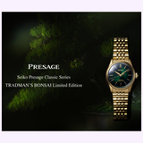A Seiko Luxe Watches Presage Classic Series HCC009 Limited Edition, featuring a gold case and green dial, is displayed beside a bonsai tree to highlight the spirit of Japanese artistry. Text reads: Seiko Luxe Watches Presage Classic Series HCC009 Limited Edition automatic watch.