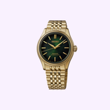 A Seiko Luxe Watches Presage Classic Series HCC009 Limited Edition wristwatch—featuring a lustrous gold case, vibrant green dial, gold hour markers, and a sleek metal link bracelet that showcases exceptional Japanese craftsmanship—is beautifully presented against a light purple background.