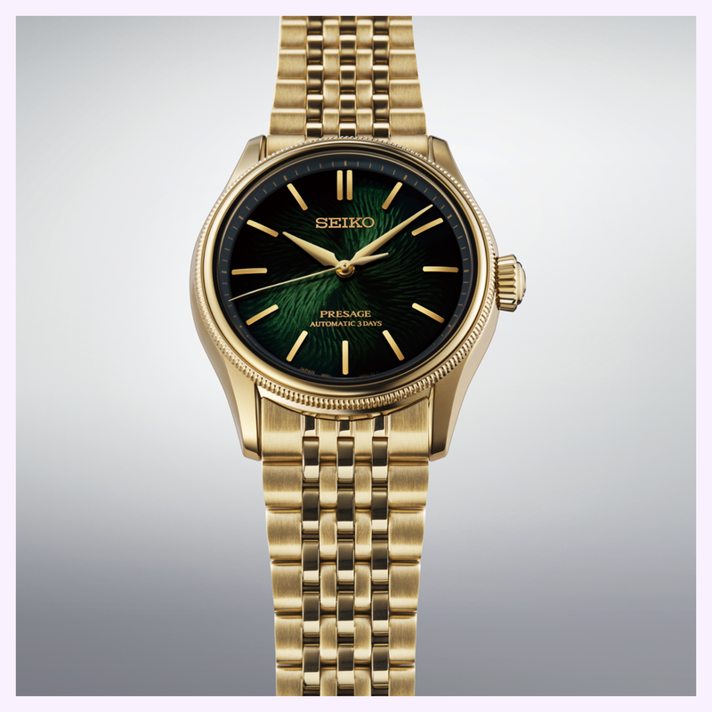 Seiko Presage HCC009 Limited Edition gold case with green dial and gold metal link bracelet close-up