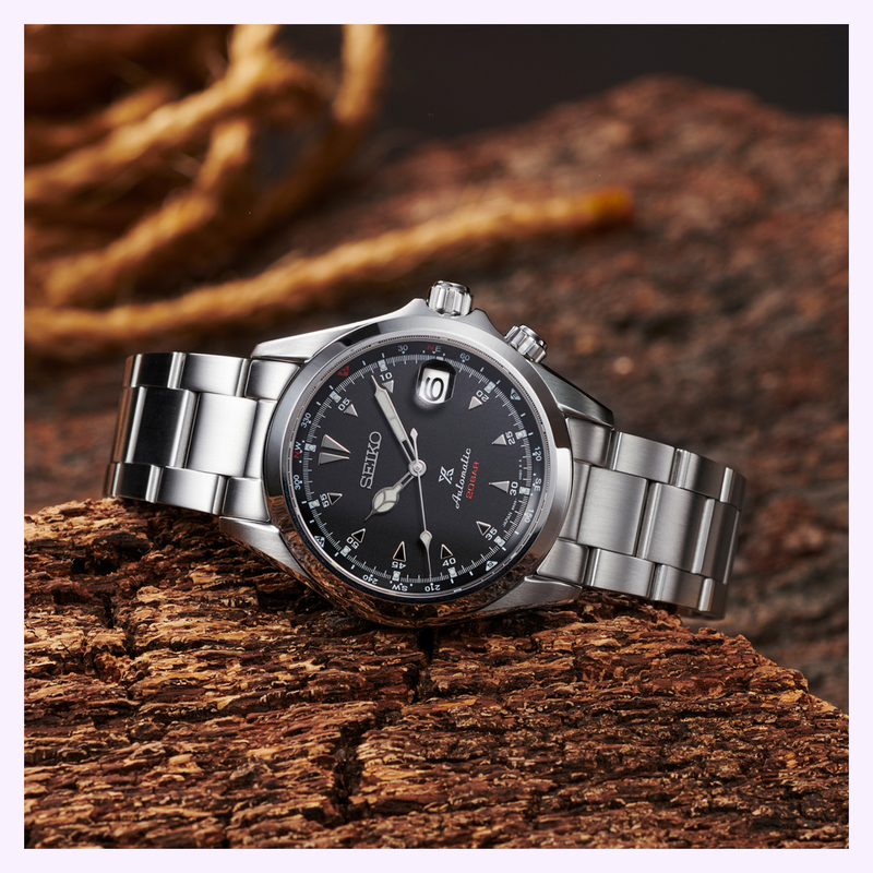 Seiko Prospex Alpinist SPB117 black sunray dial close-up showing internal compass bezel and luminous markers