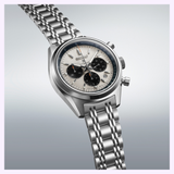 The Seiko Luxe Watches Prospex Speedtimer Mechanical Chronograph SRQ047 features a stainless steel case, silver dial with black subdials, tachymeter bezel, and multi-link bracelet, showcased on a light gradient background.