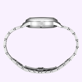 Side view of a Seiko Luxe Watches SSK037 Presage Cocktail Time with a metal bracelet, highlighting its slim profile. The crown and clasp are visible against a light purple backdrop.