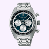 The Seiko Luxe Watches Speedtimer SRQ051, a stainless steel mechanical chronograph wristwatch by Seiko Luxe Watches, features the precise Caliber 8R48 movement. It showcases a striking blue and silver dial with three subdials, tachymeter markings, and a metal link bracelet, and is displayed against a light background.