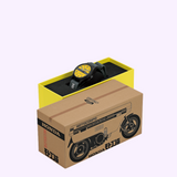 A Seiko Watches 5 Sports Field series HDB010 Honda MOTOCOMPO Limited Edition watch with a yellow face and black fabric strap, resting in an open cardboard box decorated with a line drawing of a small scooter.