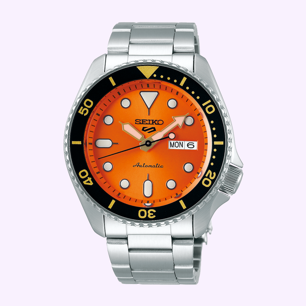 Seiko 5 Sports SKX SRPD59 with orange dial, black bezel, and day-date display