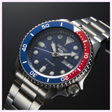 The Seiko Watches 5 Sports SRPD53 by Seiko Watches is an automatic watch with a stainless steel band, a distinctive blue and red bezel, and a blue dial that displays the day and date. The time shown is 10:08:36.