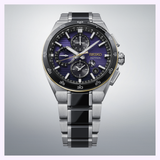 The Seiko Watches Astron HAB011J1 145th Anniversary Limited Edition wristwatch, featuring a limited edition stainless steel case, black and purple dial with multiple subdials, a date window, and silver hour markers, is displayed on a light gray gradient background.