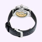 A close-up of the Seiko Luxe Watches Presage Cocktail Time Man SRPB43 shows its exposed automatic movement and black leather strap with deployment clasp—an elegant choice for Seiko fans in Miami.