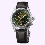 The Seiko Luxe Watches Prospex Alpinist HBC007 is inspired by the classic Seiko SSB345 Chronograph, showcasing a dark green dial paired with a brown leather strap, a silver casing, and elegant gold accents. This timepiece features a GMT hand, date window, and a reliable automatic 3-day movement, while offering water resistance up to 20 bar.
