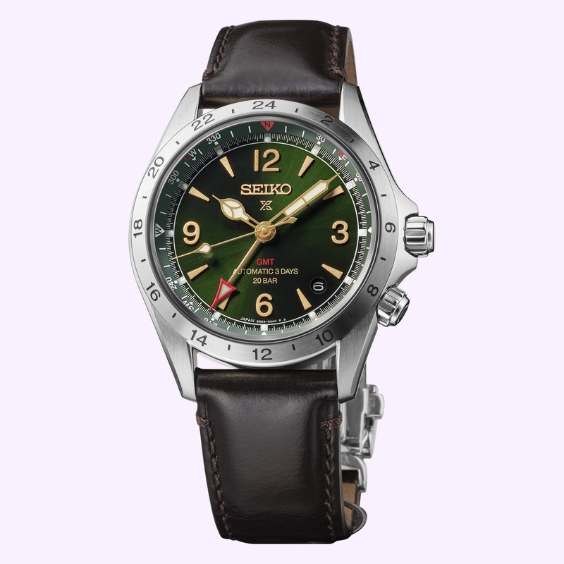 Seiko Prospex Alpinist GMT HBC007 green dial watch showing gold hands, GMT function, date window, and brown leather strap