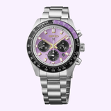 A Seiko Watches Prospex Speedtimer HBJ005 145th Anniversary Limited Edition wristwatch in stainless steel, featuring a vibrant Edo Purple dial with black chronograph subdials and a tachymeter bezel, displayed against a light purple background. This limited edition timepiece exemplifies Seiko Watches’ renowned craftsmanship and distinctive style.