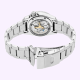 The Seiko Watches 5 Sports X Rowing Blazers SRPM21 Limited Edition wristwatch features a stainless steel band and showcases its mechanical movement through a transparent case back, with Rowing Blazers Limited Edition text, displayed on a light background.