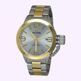 Introducing the TW Steel Canteen CB31 Men Watches Lexor Miami by TW Steel Watches—a striking wristwatch from the Canteen series. This bold men’s timepiece features a round face with large gold numbers and markers, a date display, and a silver-and-gold metal band. Designed for those who appreciate the commanding style of oversized watches, it is water resistant up to 100 meters.