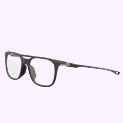 Tag Heuer Optical TH50029I 52005: Black rectangular eyeglasses with thin frames and clear lenses, shown on a light purple background. Refined style from Tag Heuer Optical, available at your Miami Authorized Dealer.