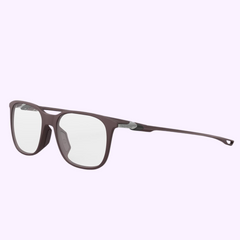 Rectangular Tag Heuer Optical TH50029I 52070 eyeglasses with a matte brown frame, clear lenses, and thin arms featuring subtle metal accents, displayed at an angle on a light purple background. UPC: 192337232534.