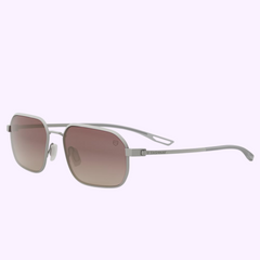 Tag Heuer Optical TH40033U 5517T sunglasses with a silver metal rectangular frame and gradient brown lenses, shown on a light purple background. 100% authentic from an Authorized Dealer in Miami. UPC: 192337232749.