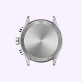 The back of a Tissot Watches Chrono L 42mm T1164171109200 stainless steel case, with engravings detailing its water resistance, material, and model, as well as its precise Swiss Quartz movement, set against a light purple background.