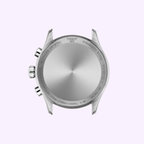 The back of a Tissot Watches Chrono L 42mm T1164171605200 stainless steel case, in silver, displays engraved details such as Sapphire Crystal, Water Resistant 100M, Stainless Steel, and Swiss Quartz Movement against a light purple background.