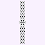 A polished multi-link stainless steel bracelet, designed for women and featuring a clasp engraved with “Tissot 1853,” is displayed vertically against a light purple background, showcasing the timeless elegance of the Tissot Watches Classic Dream 28mm T1292101105300 Swiss quartz watch.