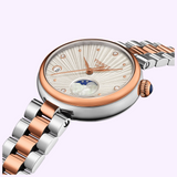 Tissot Watches Desir 29.6mm T1522232203600 analog watch featuring a round silver and rose gold case, textured white dial with diamond indices, and a two-tone silver and rose gold metal link bracelet.