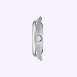 Side profile of the Tissot Watches Gentleman 38mm T1658071109100 in sleek silver, featuring a crown with engraved T logo, shown against a light purple background.
