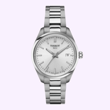 The Tissot Watches PR 100 34mm T1502101103100 is a sophisticated silver wristwatch by Tissot Watches, featuring a stainless steel case and metal band, white dial with silver hour markers, and a date display at the 3 o’clock position. Powered by reliable Swiss Quartz movement, this elegant timepiece is showcased against a light purple background.