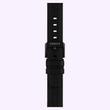 Black Tissot Watches rubber strap with rectangular holes and a black buckle, displayed vertically on a light purple background—perfect as a replacement for your chronograph or the Tissot Watches PR 100 Tour de France 2026 40mm (T1504173705700) model.