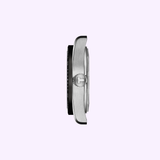 A side view of the Tissot Watches PR516 38mm T1494071103100 case in silver showcases its crown and sleek profile against a plain light background, emphasizing the refined Swiss engineering and Powermatic 80 automatic movement of this Tissot Watches timepiece.