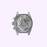 Back view of the Tissot Watches PR516 41mm T1494592105100 wristwatch highlighting the exposed Swiss manual winding movement and intricate gears, with detailed text engraved on the stainless steel case. The background is a light purple hue.