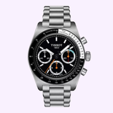The Tissot Watches PR516 41mm T1494592105100 showcases a stainless steel construction with a sleek black dial, three subdials, white and orange hands, and a tachymeter scale on the bezel. Displayed on a pale background, this eye-catching timepiece from Tissot Watches features classic Swiss manual winding movement for precise timekeeping.
