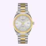 Displayed against a light purple background, the Tissot Watches PRC 100 Solar 34mm T1518222203100 stands out with its stainless steel case, elegant silver and gold metal band, and crisp white dial highlighted by gold accents. The easy-to-read date window at 3 o’clock combines with Swiss precision in this refined solar-powered Swiss quartz timepiece from Tissot Watches—a perfect blend of elegance and advanced technology.