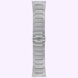 A brushed stainless steel watch band with geometric links and “TISSOT 1853” engraved on the clasp, designed for the Tissot Watches PRX 40mm T1374101140100 by Tissot Watches, showcased against a light purple background.