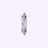A side view of the Tissot Watches PRX 40mm T1374101140100, featuring a sleek silver minimalist design and a single crown, set against a light purple background.