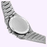 Back view of the Tissot Watches PRX 41mm T1374171105100, featuring a brushed stainless steel case and bracelet, along with engraved details indicating water resistance, sapphire crystal, and stainless steel construction.