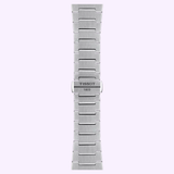 A silver metal watch band with a brushed finish, bearing the brand name Tissot Watches engraved on the clasp, is displayed vertically against a light purple background—an ideal match for the iconic Tissot Watches PRX 42mm T1374271104101 Swiss automatic chronograph featuring a sapphire crystal.
