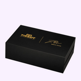 Black rectangular Tissot Watches PRX T1374051737100 Skeleton Damian Lillard Special Edition box with gold lettering reading Tissot and Damian Lillard, along with a gold signature for this special edition.